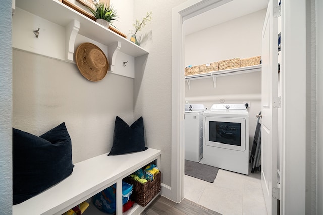 10215 Napier Dr, Rosharon, TX 77583 - laundry room with washing machine and clothes dryer and baseboards