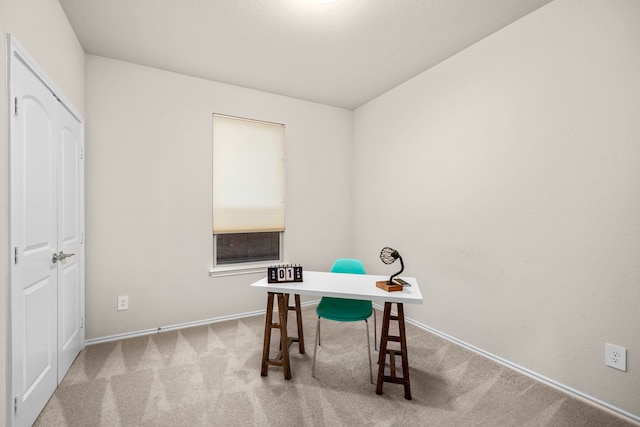 office space featuring baseboards and carpet floors
