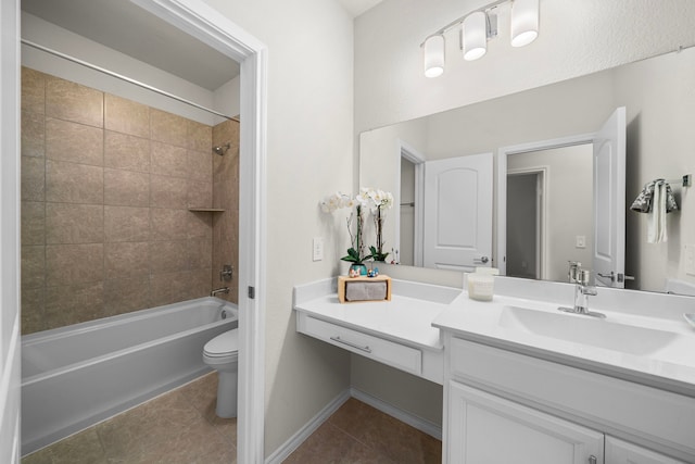 full bath with tub / shower combination, vanity, toilet, and tile patterned floors