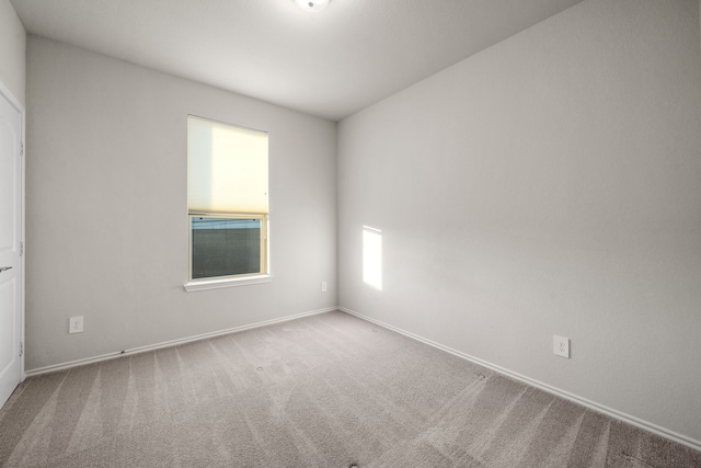 spare room featuring carpet
