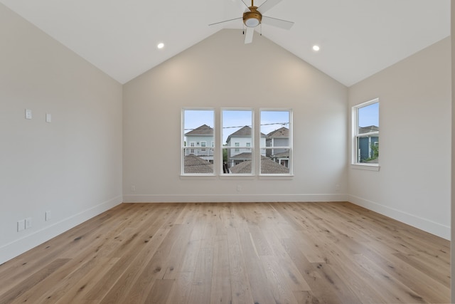 spare room with recessed lighting, baseboards, light wood-style flooring, high vaulted ceiling, and ceiling fan