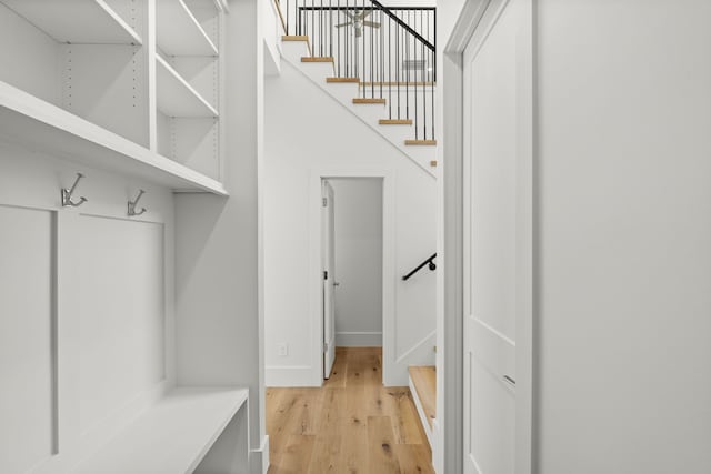 mudroom with light wood-type flooring and baseboards