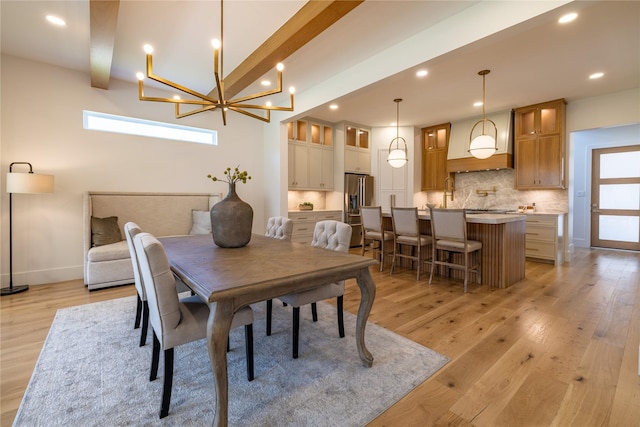 710 Waverly St Unit D, Houston, TX 77007 - dining space featuring healthy amount of natural light, light wood-style flooring, recessed lighting, beam ceiling, and a chandelier