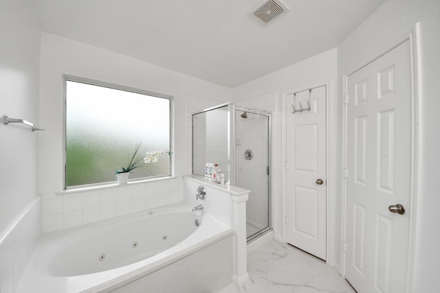 bathroom with marble finish floor, a whirlpool tub, a stall shower, and visible vents