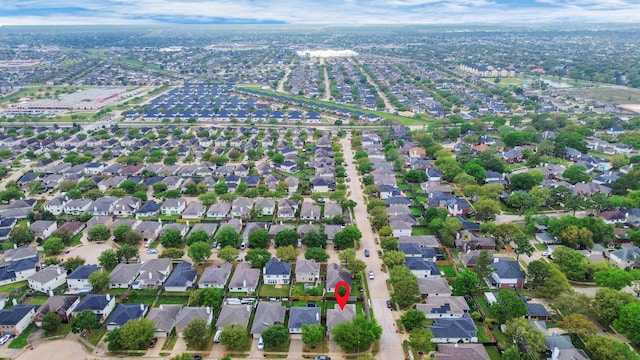 birds eye view of property with a residential view