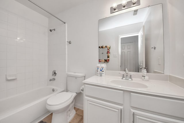 full bath featuring bathtub / shower combination, toilet, and vanity
