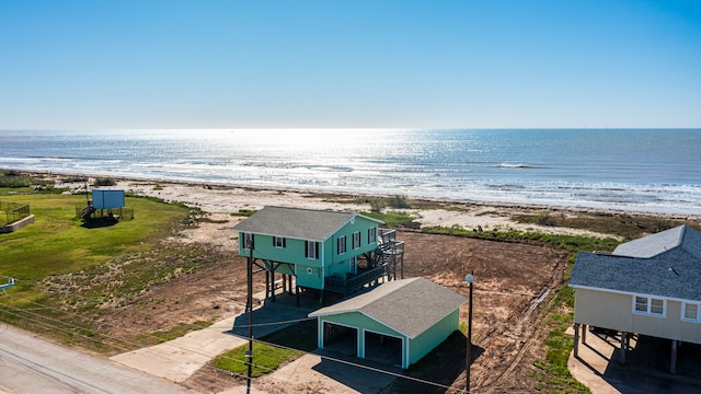 drone / aerial view with a view of the beach and a water view