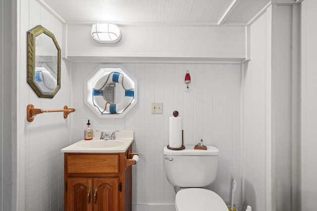 bathroom with toilet and vanity