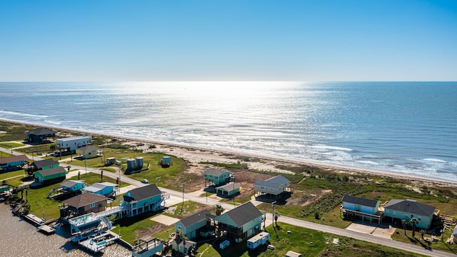 aerial view with a water view, a beach view, and a residential view