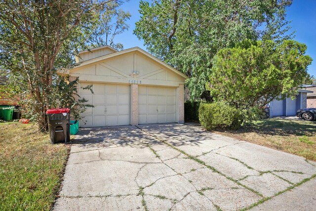 24203 Landing Way Dr, Spring, TX 77373 - view of front of property with a garage and concrete driveway
