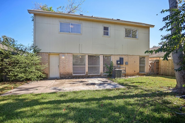 24203 Landing Way Dr, Spring, TX 77373 - back of house featuring brick siding, a patio, and central AC