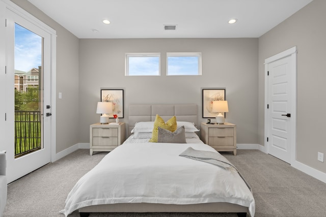 1177 W 19th St, Houston, TX 77008 - bedroom featuring multiple windows, carpet flooring, access to outside, and visible vents