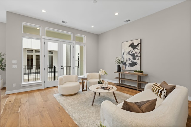 1177 W 19th St, Houston, TX 77008 - living area with recessed lighting, french doors, visible vents, and wood finished floors