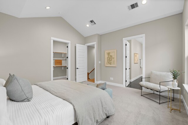 1177 W 19th St, Houston, TX 77008 - carpeted bedroom featuring lofted ceiling, a spacious closet, baseboards, and visible vents