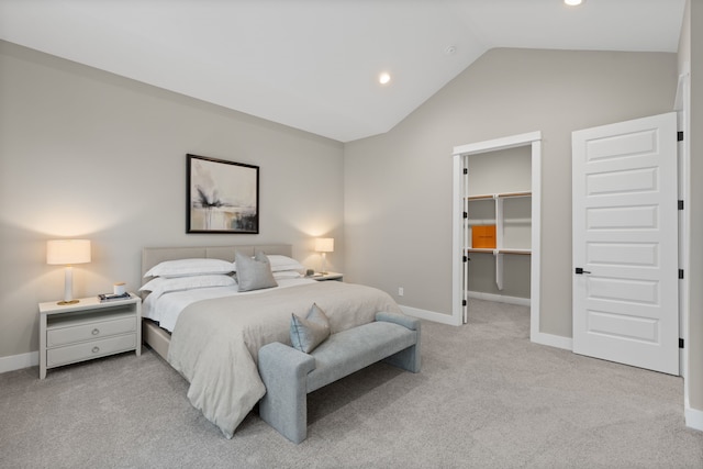 1177 W 19th St, Houston, TX 77008 - bedroom with lofted ceiling, recessed lighting, baseboards, a walk in closet, and light colored carpet