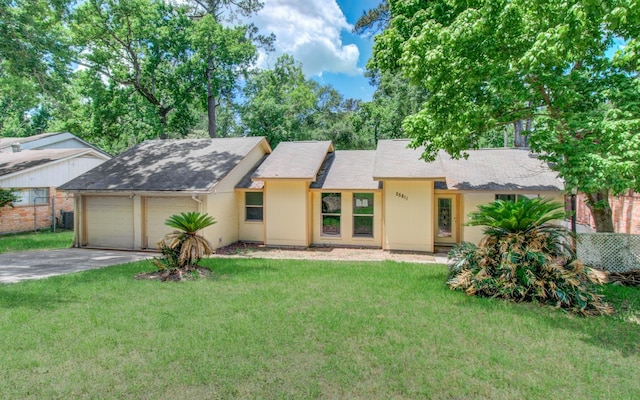12728 Hollandale Dr, Houston, TX 77082 - view of front of house with driveway, a front lawn, a garage, and roof with shingles