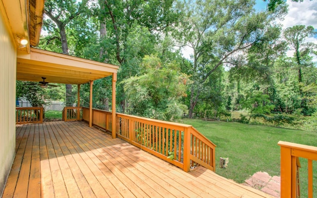 12728 Hollandale Dr, Houston, TX 77082 - wooden deck featuring a lawn, ceiling fan, and view of wooded area