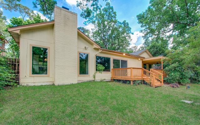 12728 Hollandale Dr, Houston, TX 77082 - rear view of property with a chimney, a wooden deck, and a lawn