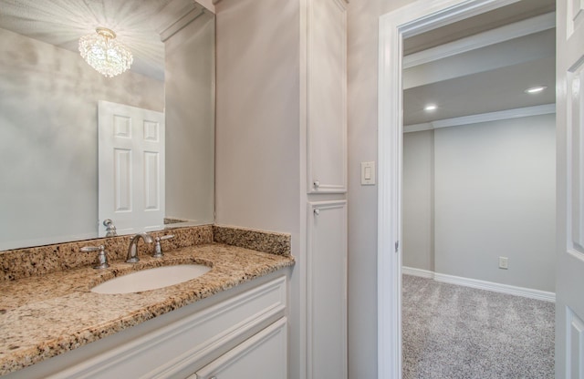 12728 Hollandale Dr, Houston, TX 77082 - bathroom with vanity, a chandelier, recessed lighting, and crown molding