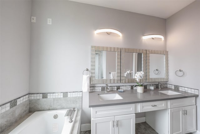 1005 Bingham St Unit 5, Houston, TX 77007 - bathroom featuring double vanity, a garden tub, and a sink