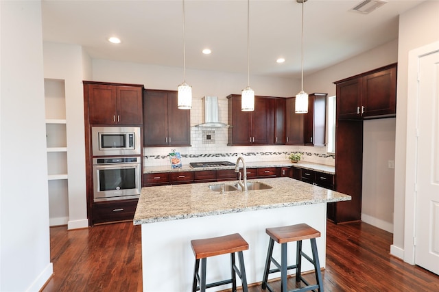 1005 Bingham St Unit 5, Houston, TX 77007 - kitchen featuring wall chimney range hood, a sink, stainless steel appliances, dark wood-type flooring, and backsplash