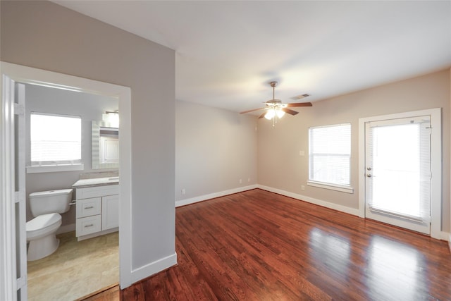 1005 Bingham St Unit 5, Houston, TX 77007 - interior space featuring a ceiling fan, a wealth of natural light, and wood finished floors