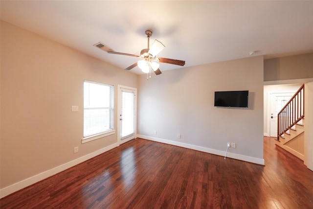 1005 Bingham St Unit 5, Houston, TX 77007 - spare room featuring ceiling fan, stairs, visible vents, baseboards, and dark wood finished floors