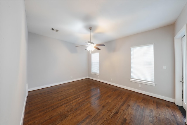 1005 Bingham St Unit 5, Houston, TX 77007 - spare room featuring a ceiling fan, visible vents, baseboards, and dark wood-type flooring