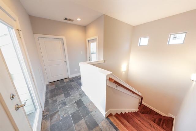 1005 Bingham St Unit 5, Houston, TX 77007 - staircase with stone tile floors, visible vents, recessed lighting, and baseboards