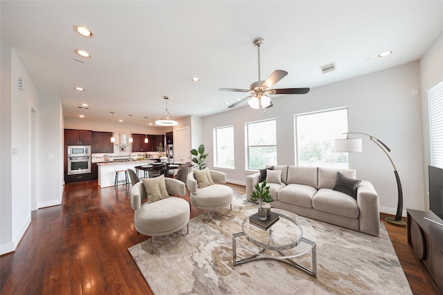 1005 Bingham St Unit 5, Houston, TX 77007 - living area with dark wood-style flooring, visible vents, and recessed lighting