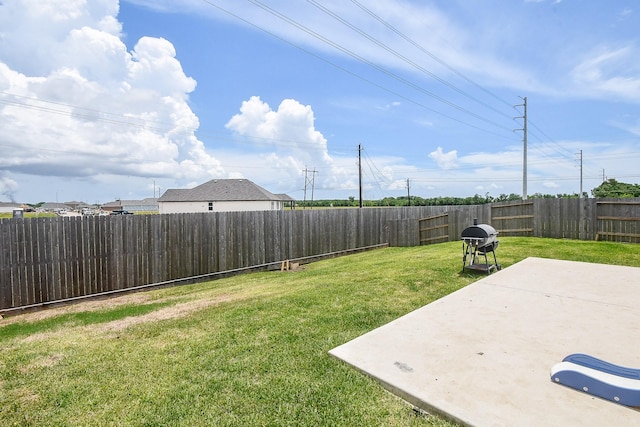 view of yard with a fenced backyard and a patio area