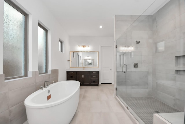 21123 Flowerhorn Dr, Cypress, TX 77433 - full bathroom featuring a stall shower, a freestanding tub, and vanity
