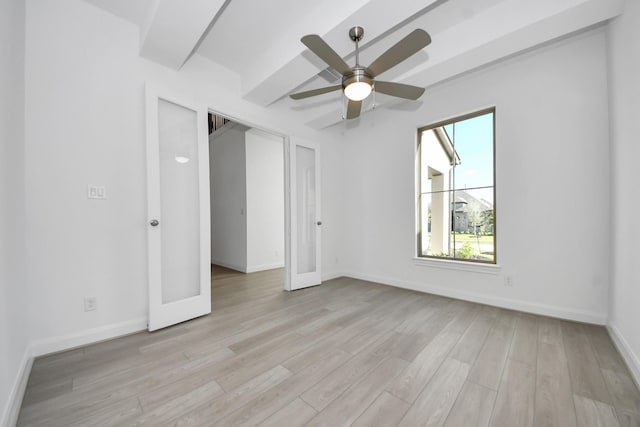 21123 Flowerhorn Dr, Cypress, TX 77433 - unfurnished bedroom with multiple windows, light wood-style floors, and ceiling fan