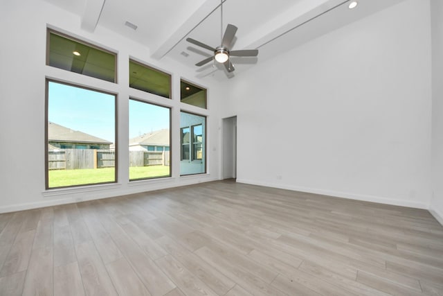 21123 Flowerhorn Dr, Cypress, TX 77433 - unfurnished room featuring light wood-type flooring, beam ceiling, and ceiling fan