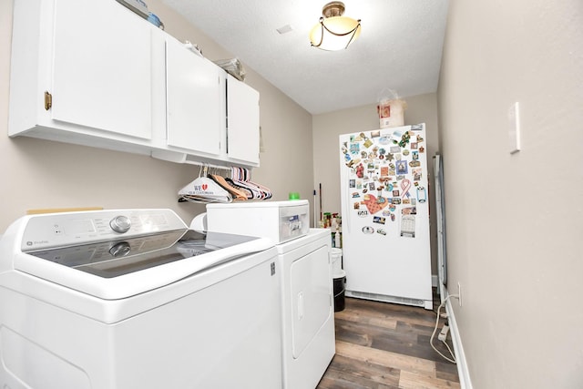 20202 Deer Run Rd, Damon, TX 77430 - washroom with dark wood finished floors, cabinet space, and washer and dryer