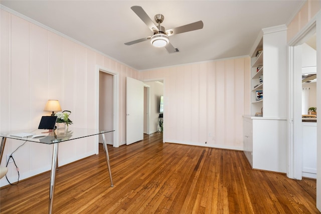 6625 Fairfield St, Houston, TX 77023 - unfurnished living room featuring ornamental molding, wood-type flooring, and a ceiling fan