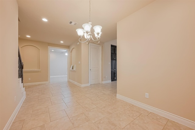 empty room featuring recessed lighting, visible vents, baseboards, and ceiling fan with notable chandelier