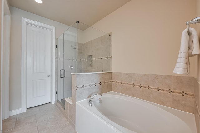 full bathroom with a shower stall, tile patterned floors, and a garden tub