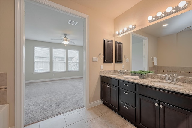 bathroom with a sink, visible vents, tile patterned floors, and a ceiling fan