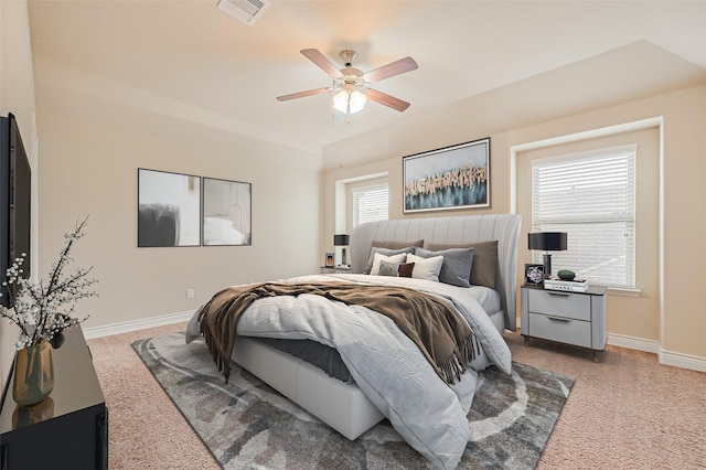 bedroom featuring baseboards, a ceiling fan, and visible vents