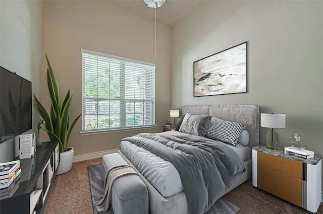 carpeted bedroom featuring baseboards