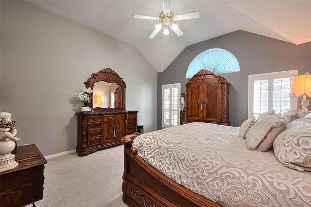 bedroom with baseboards, ceiling fan, vaulted ceiling, and light colored carpet