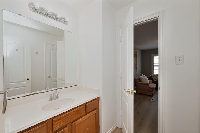 bathroom featuring vanity and wood finished floors