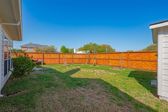 view of yard featuring a fenced backyard
