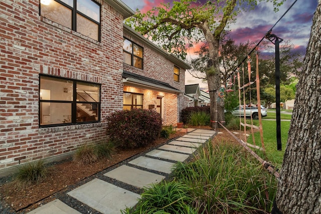 14514 Bramblewood Dr, Houston, TX 77079 - property exterior at dusk with brick siding