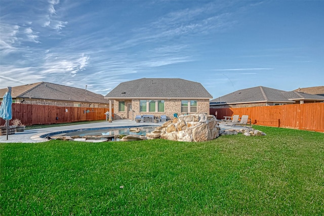 4603 Red Yucca Dr, Baytown, TX 77521 - back of house featuring a hot tub, a patio, and brick siding