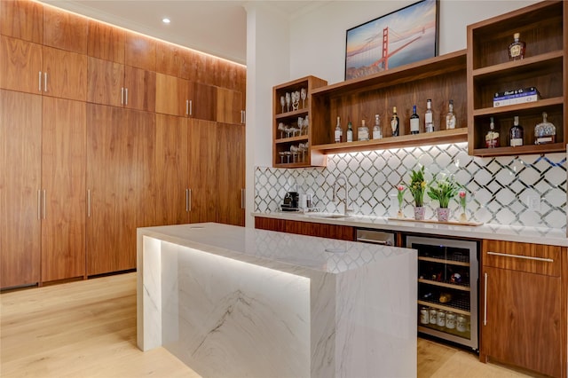 1810 Dunlavy St, Houston, TX 77006 - community bar area with beverage cooler, backsplash, and light wood finished floors