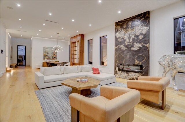 1810 Dunlavy St, Houston, TX 77006 - living area with light wood-style flooring, recessed lighting, and a chandelier