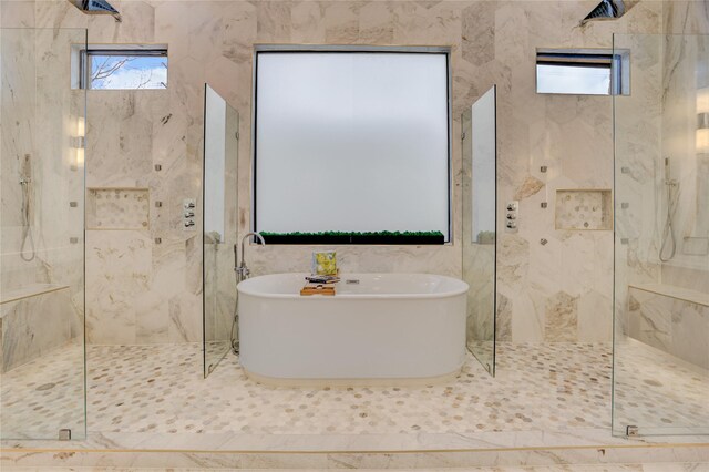 1810 Dunlavy St, Houston, TX 77006 - full bathroom featuring a marble finish shower, a freestanding tub, and tile walls