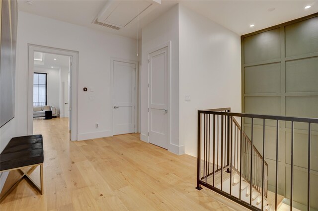 1810 Dunlavy St, Houston, TX 77006 - hall with attic access, light wood-style floors, an upstairs landing, and recessed lighting